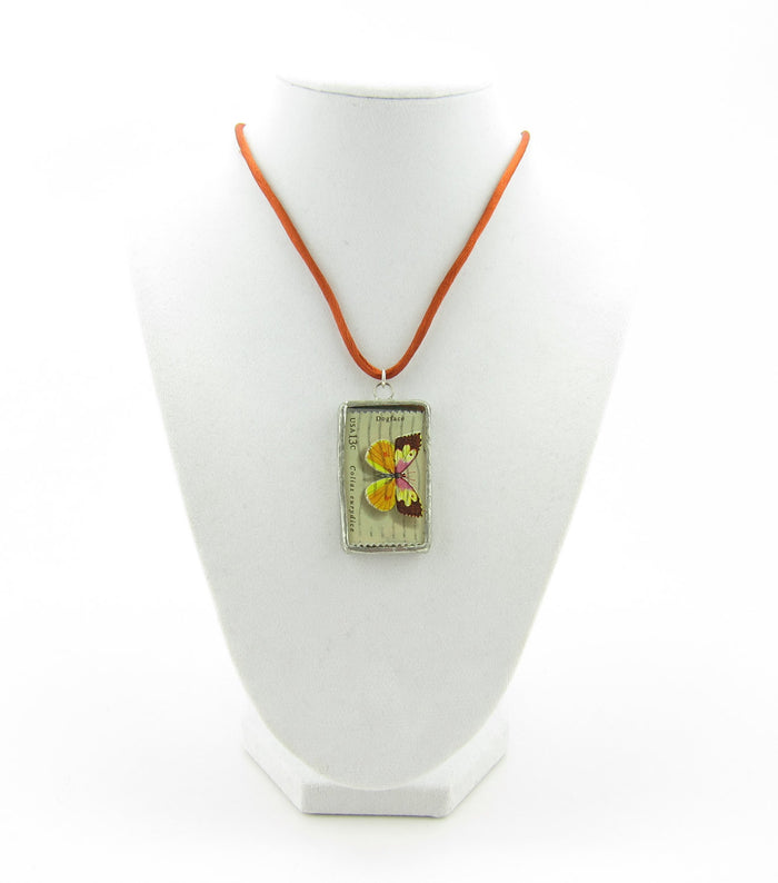 Dogface butterfly stamp in glass pendant