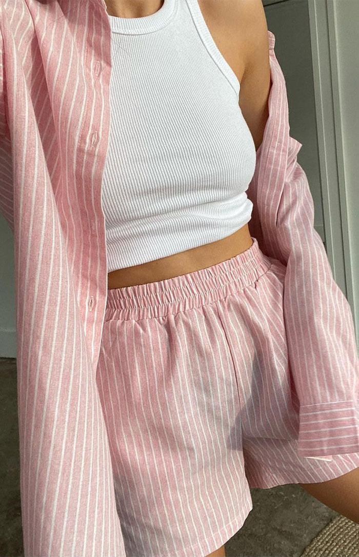 Pink and white pinstripe shorts with a gathered elasticated high waist and relaxed fit