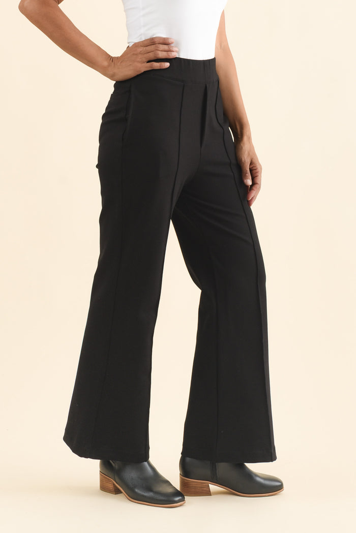 Themis Black Ponte Flare Pants,Brunette model,alt text|model:Cara