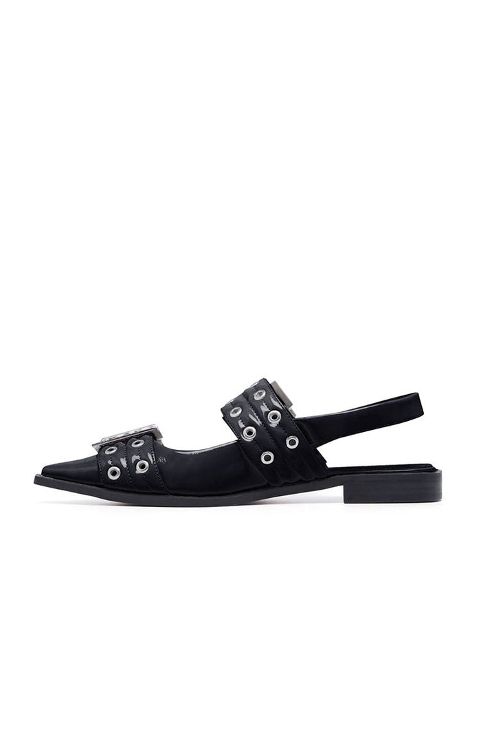 Side view of black patent pointed flats with quilted eyelet straps, buckle, and slingback